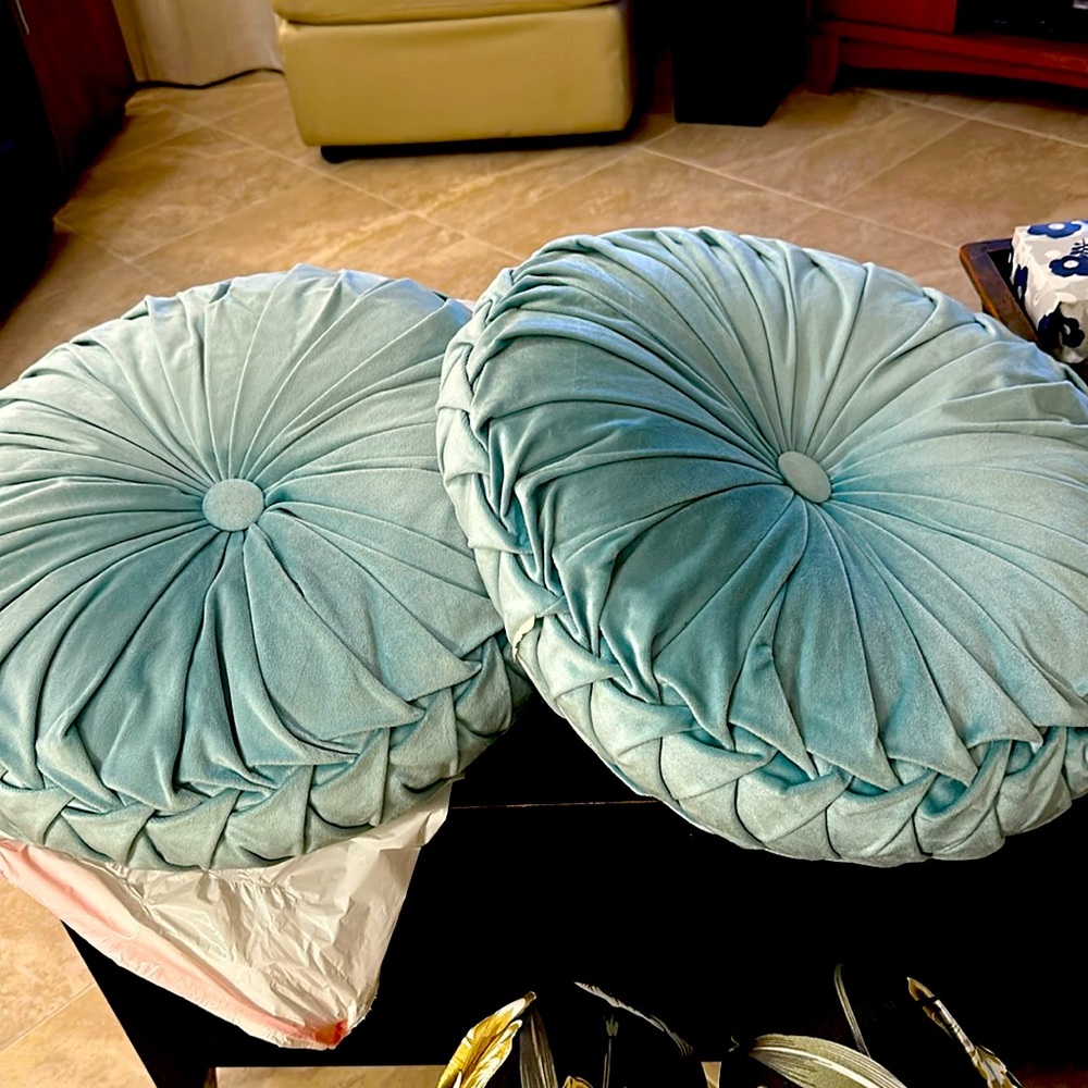 Two teal round, perfectly cut pillows, soft, and Valore